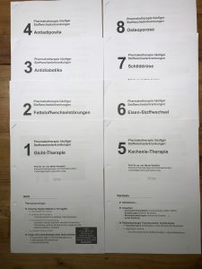 a group of white papers with black text