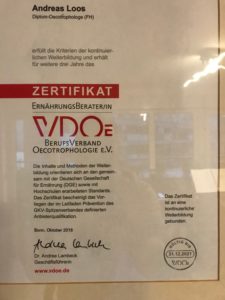 a certificate with red text and black text